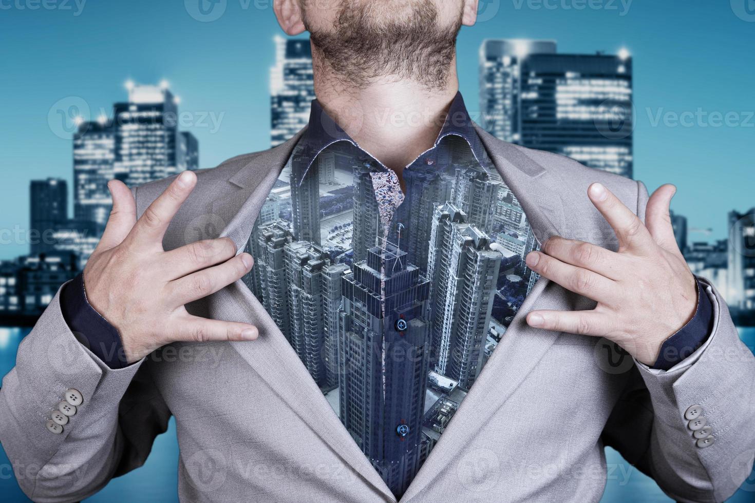 Double exposure image of a business man against a modern city background. The concept of the future of business and communication technologies. photo