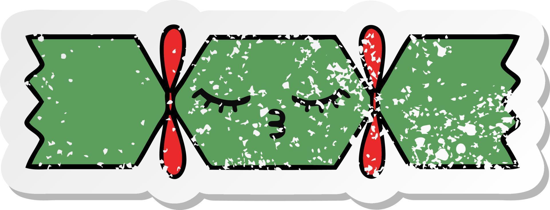 distressed sticker of a cute cartoon christmas cracker vector