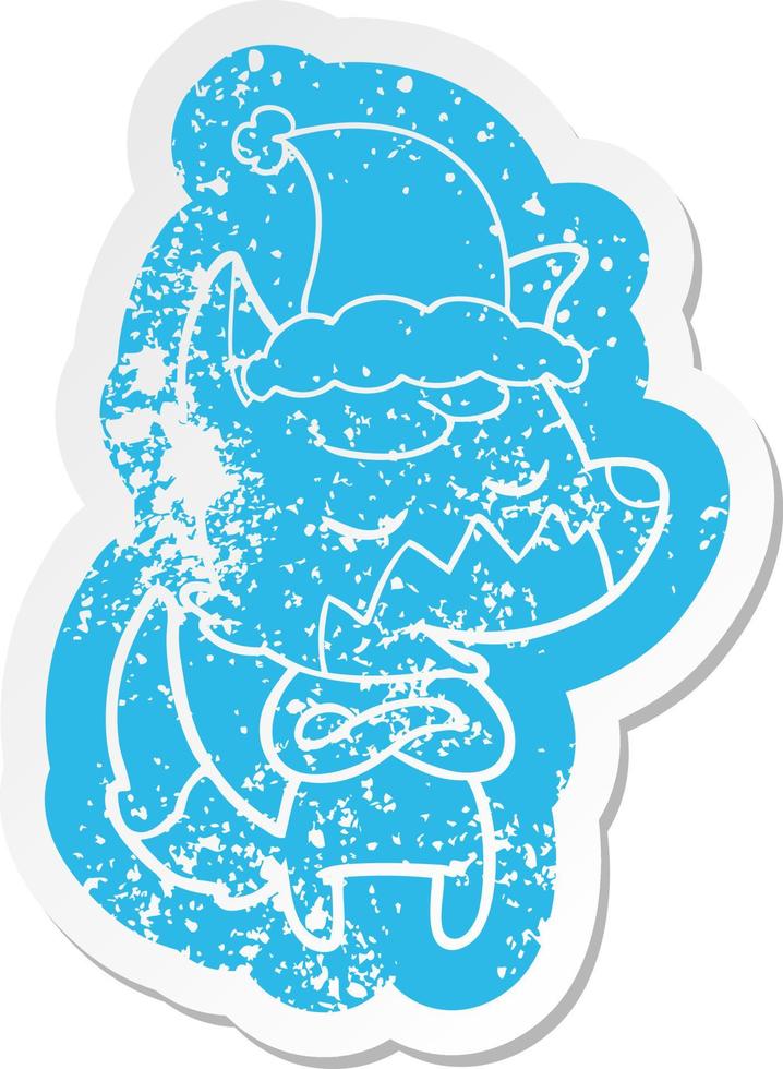 friendly cartoon distressed sticker of a fox wearing santa hat vector