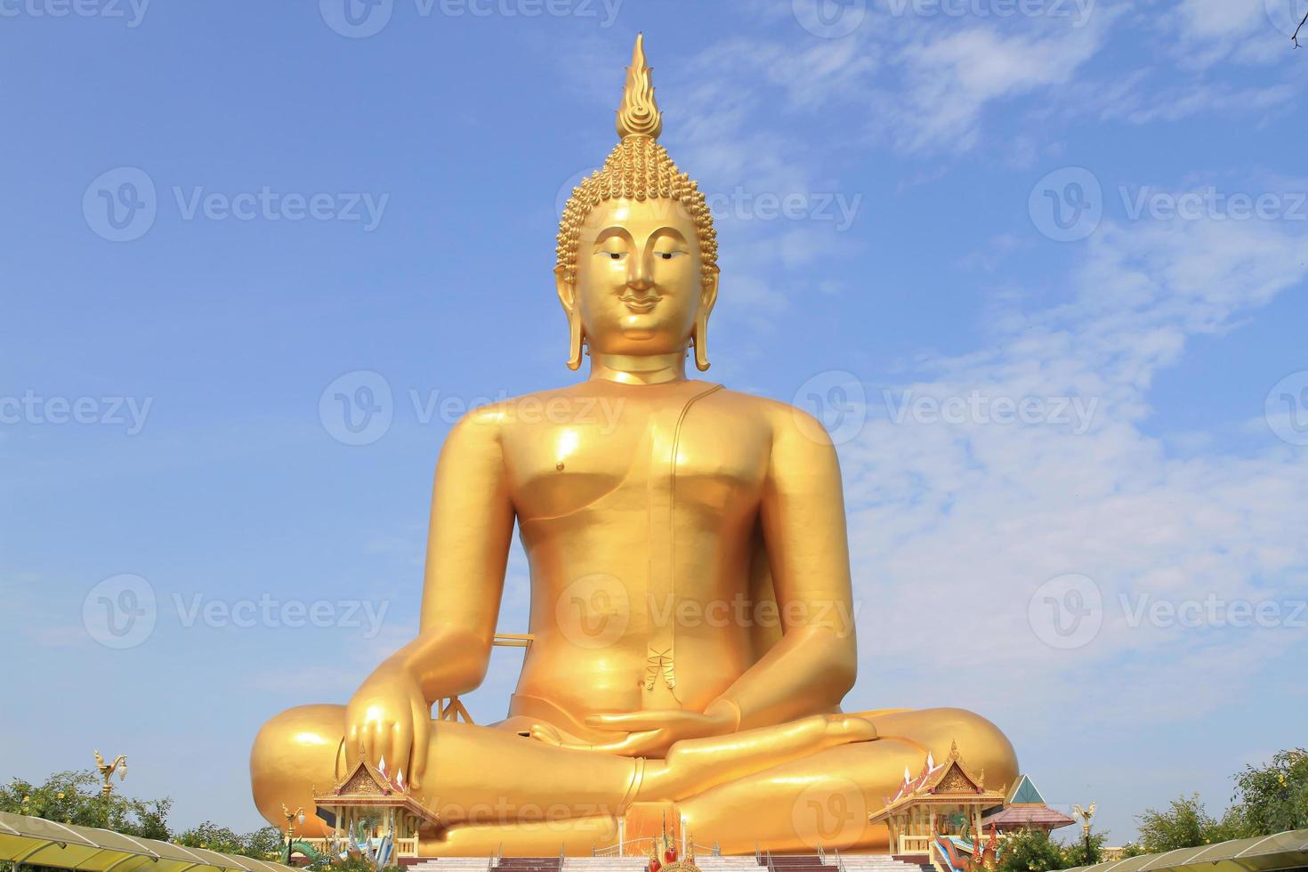Big Buddha image on blue sky background photo