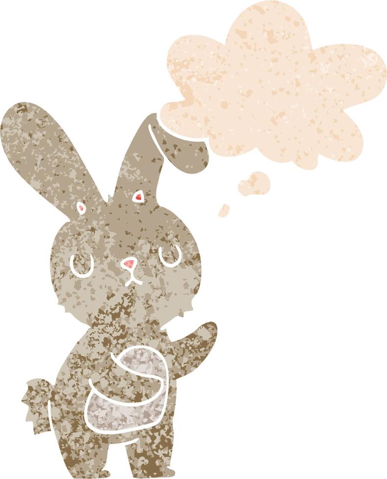 lindo conejo de dibujos animados y burbuja de pensamiento en estilo retro texturizado vector