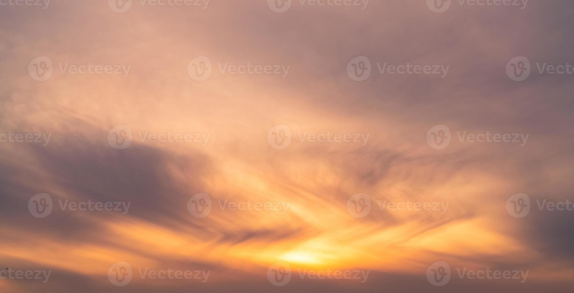 Beautiful sunrise sky. Orange, grey, and white sky. Colorful sunrise. Art picture of sky at sunrise. Sunrise and clouds for inspiration background. Nature background. Peaceful and tranquil concept. photo