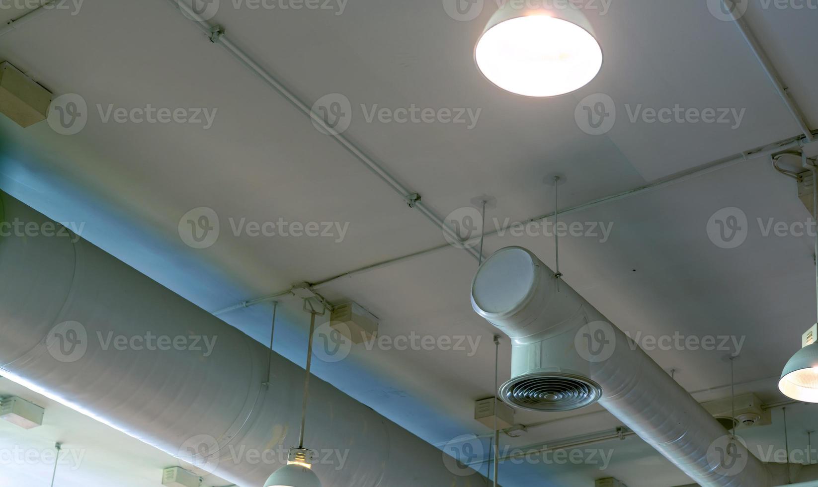 Air duct, automatic fire sprinkler safety system. Fire protection and detector. Fire sprinkler system. Building interior concept. Ceiling lamp light with opened light. Interior architecture concept. photo