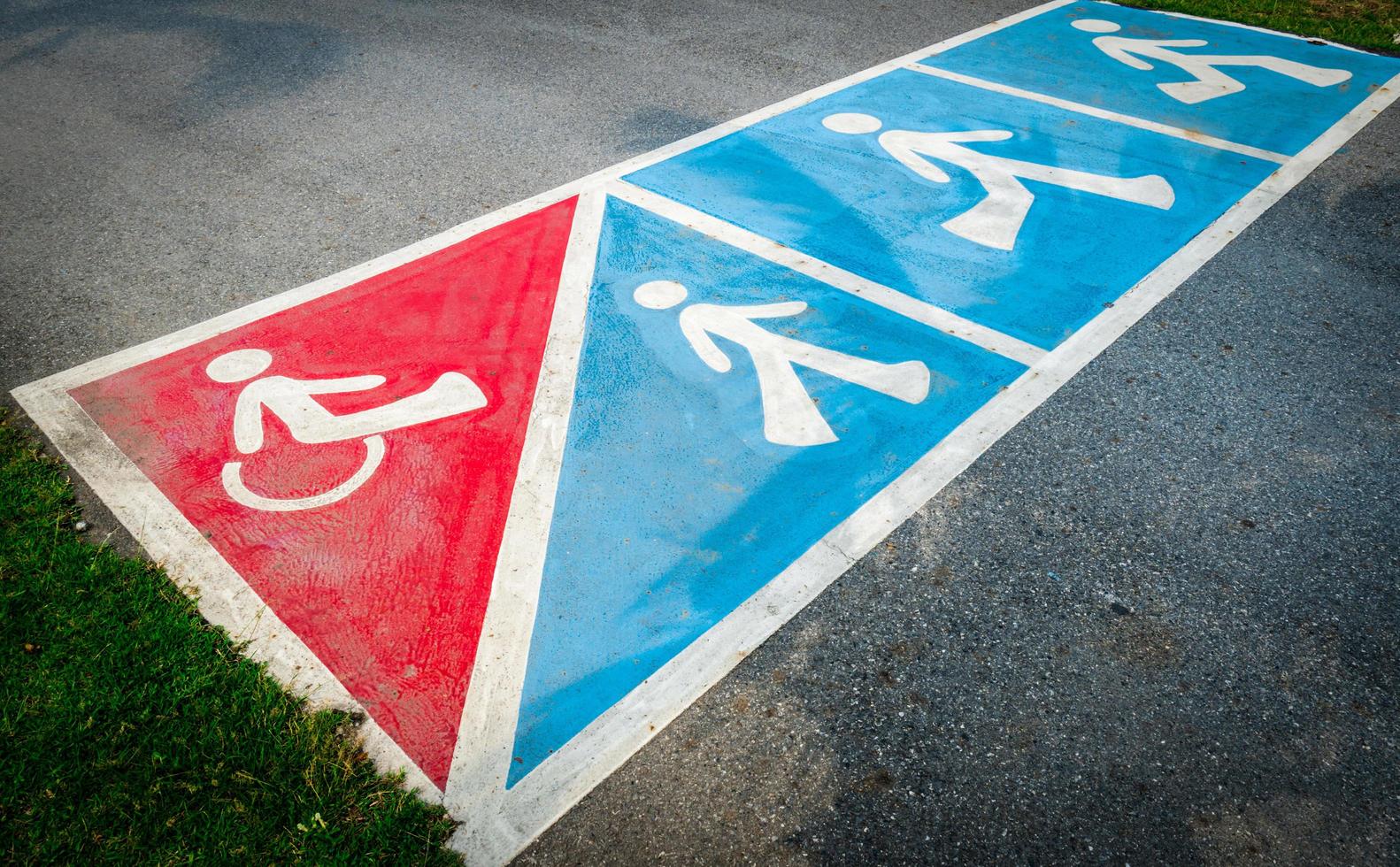 Traffic sign paint on asphalt road for wheelchair or pedestrian walk photo