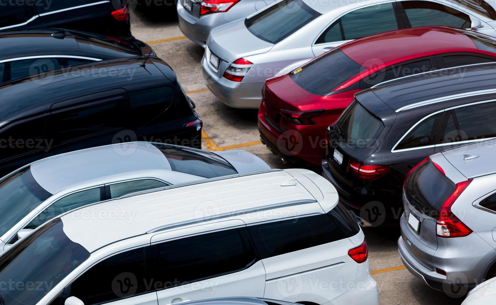 Car parked at parking lot of the airport for rental. Aerial view of car parking lot of the airport. Used luxury car for sale and rental service. Automobile parking space. Car dealership concept. photo