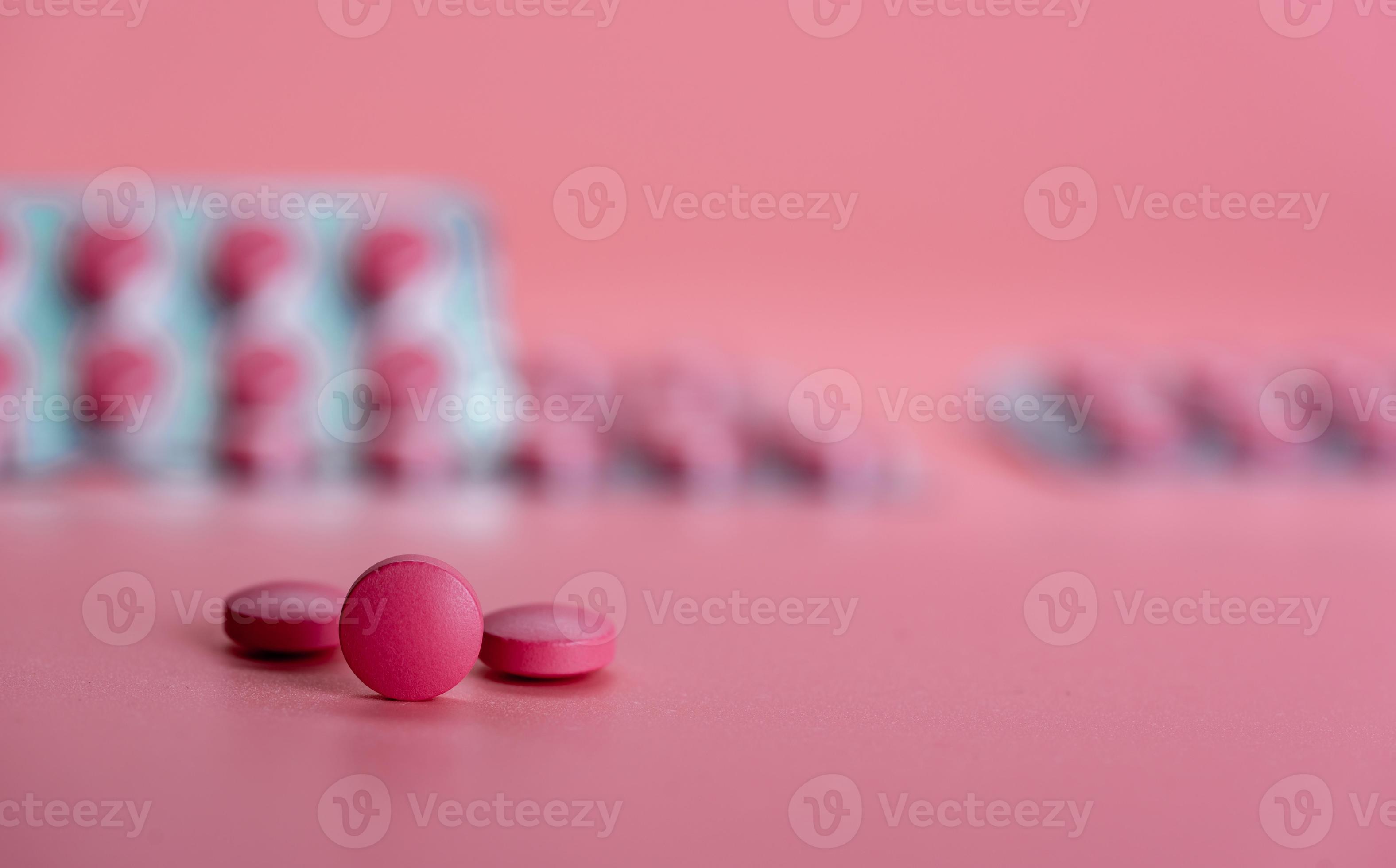 Round pink tablet pill on blur blister pack. Prescription drug