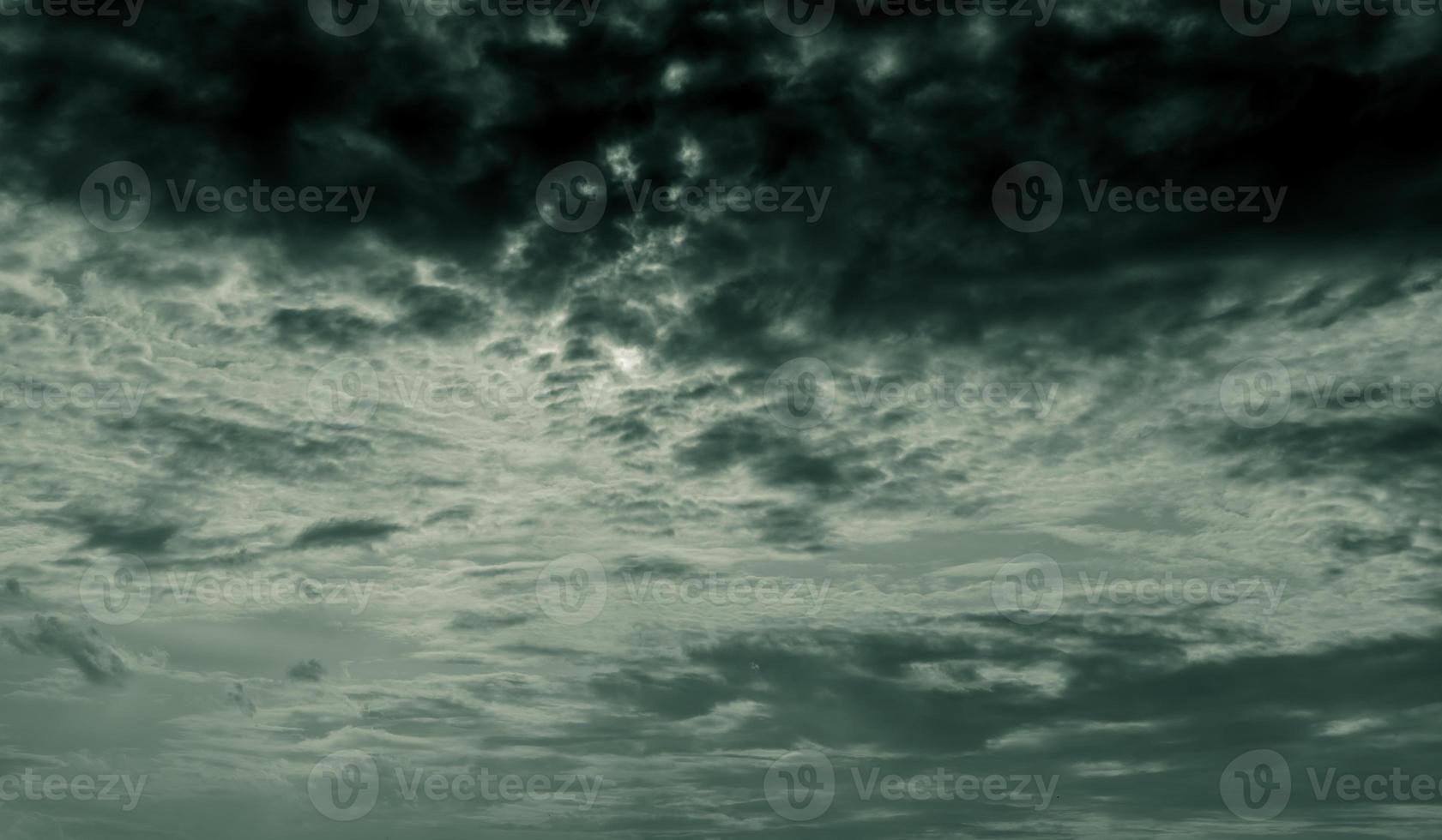 Dark dramatic sky and clouds. Background for death and sad concept. Gray sky and fluffy white clouds. Thunder and storm sky. Sad and moody sky. Nature background. Dead abstract background. Cloudscape. photo