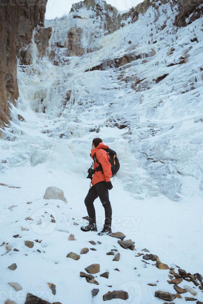 Man hiking in snow photo