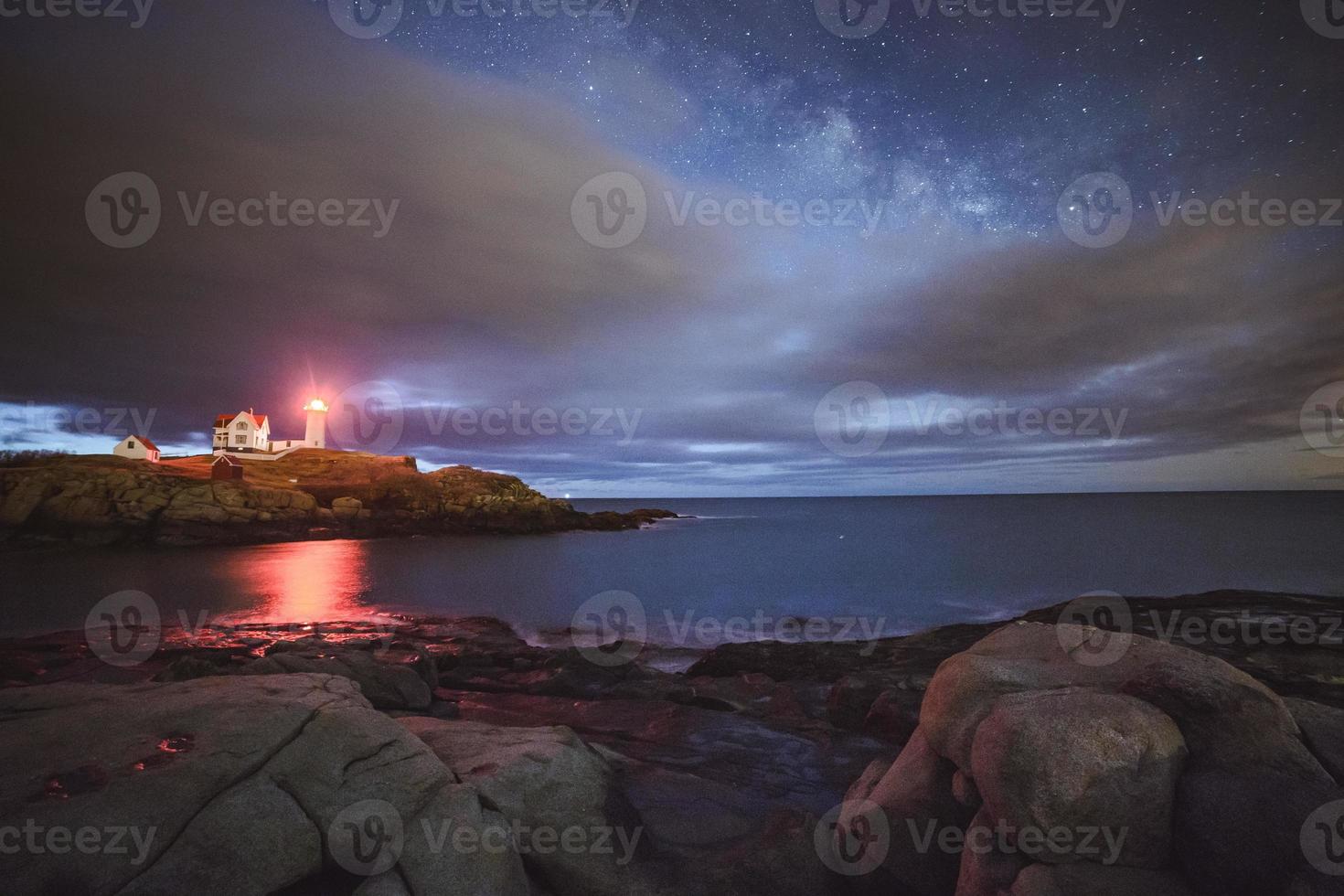 Lighthouse at night photo