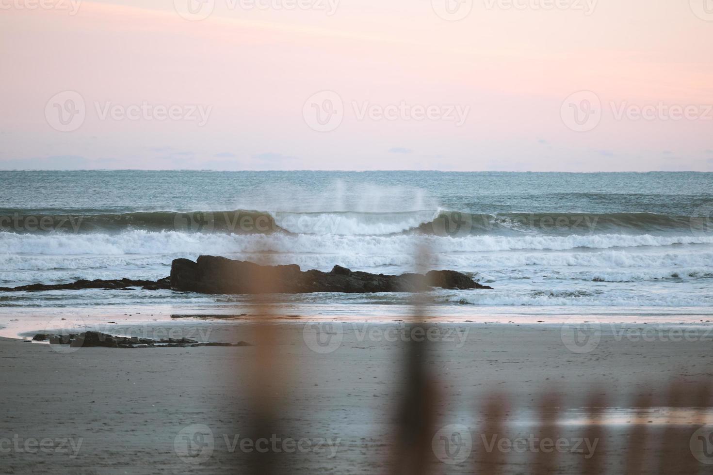 Waves at sunset photo