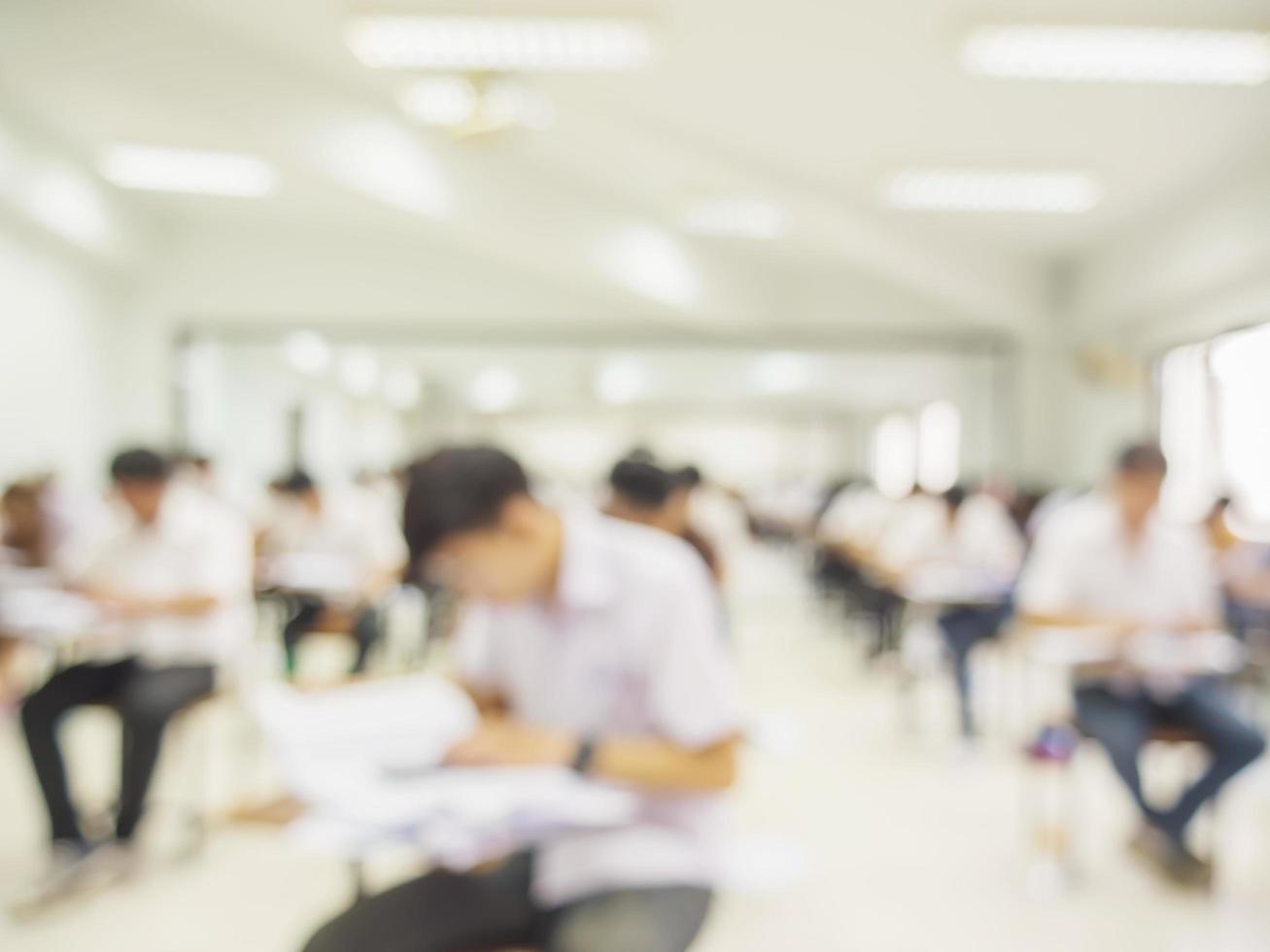 Blurred picture of student in the examination room photo