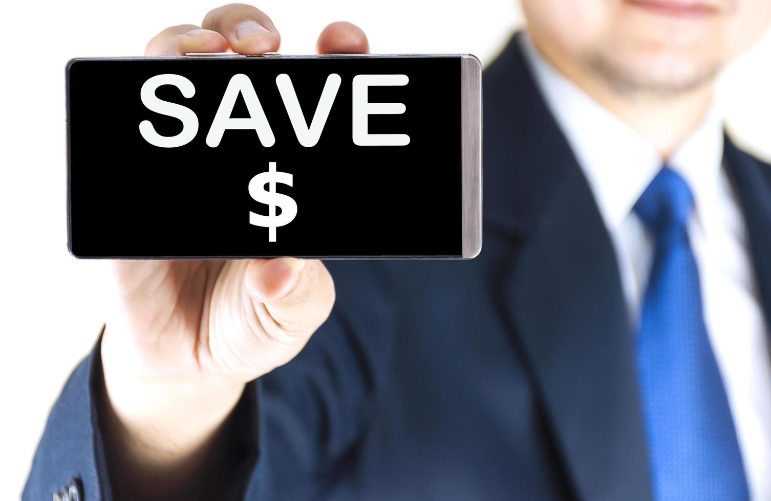SAVE , word on mobile phone screen in blurred young businessman hand over white background, business concept photo