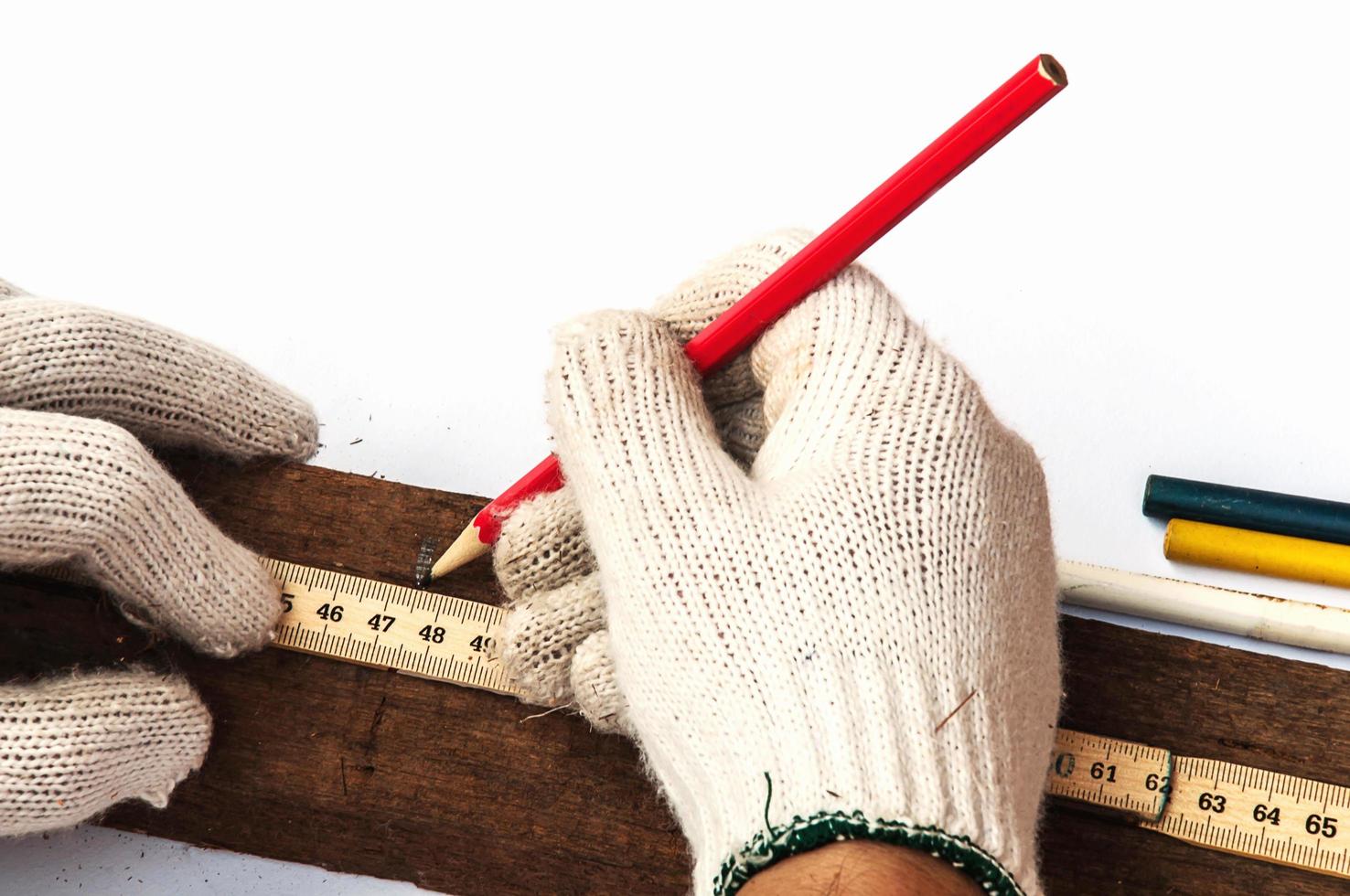 Male hands with ruler and pencil closeup photo