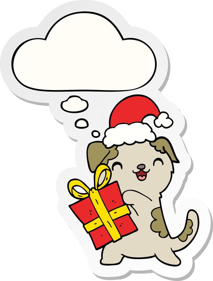 cute cartoon puppy with christmas present and hat and thought bubble as a printed sticker vector