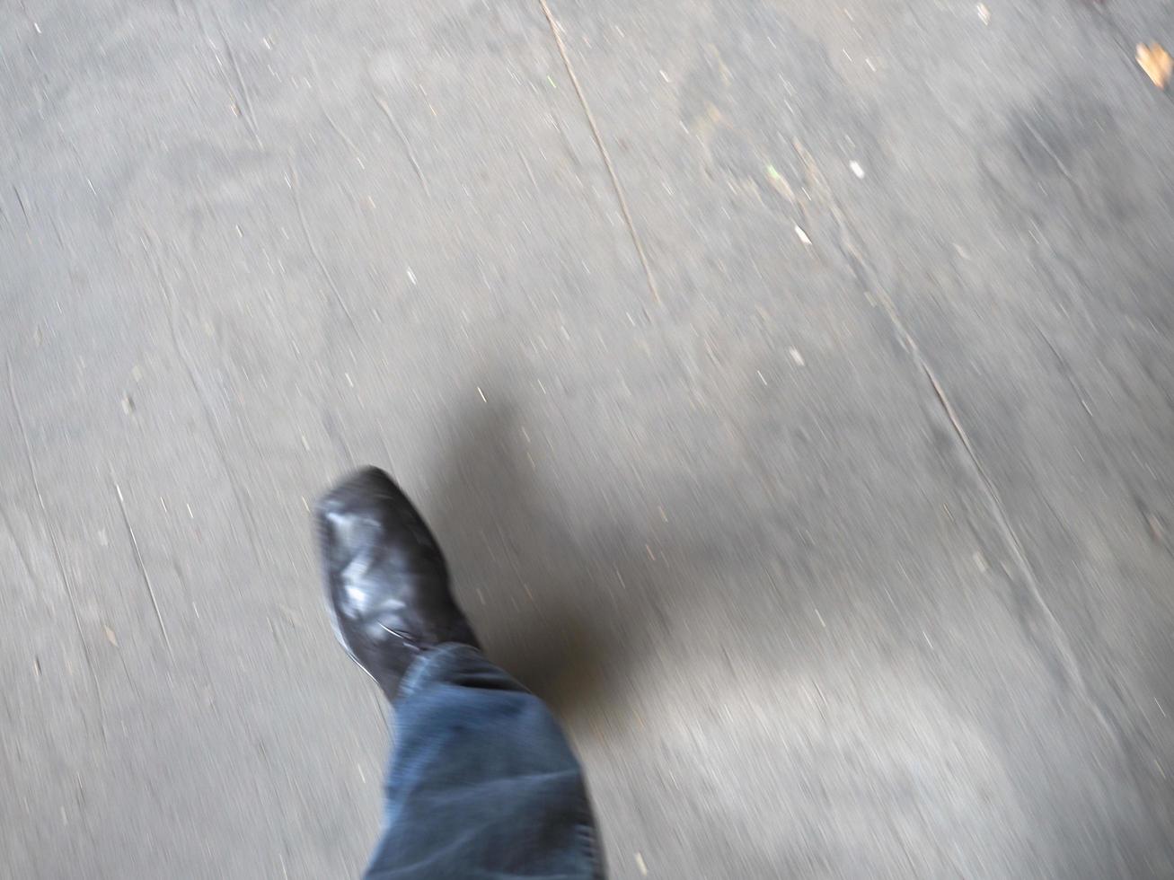 personal pov of man walking with motion blur photo