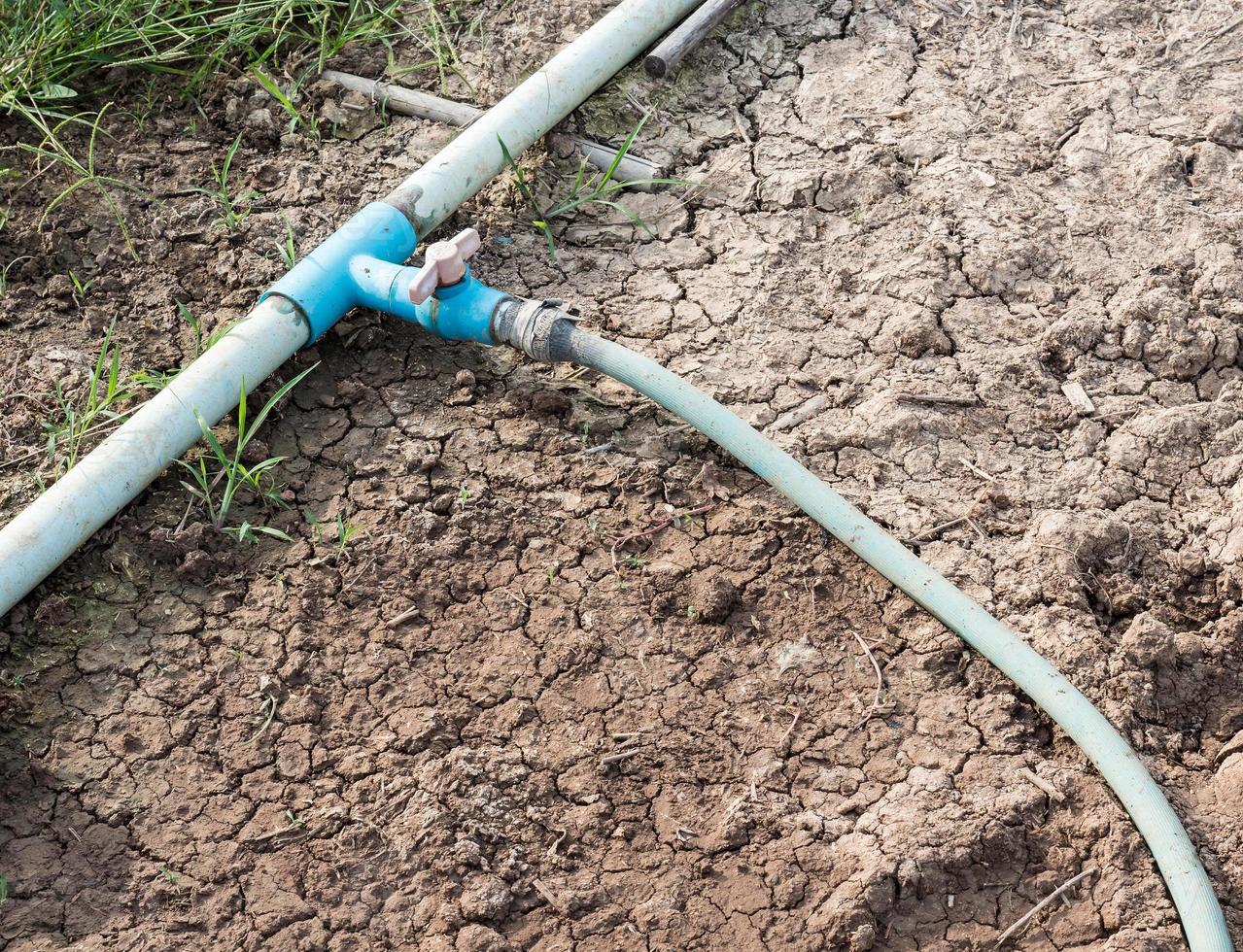 Old PVC pipe with the rubber hose. photo