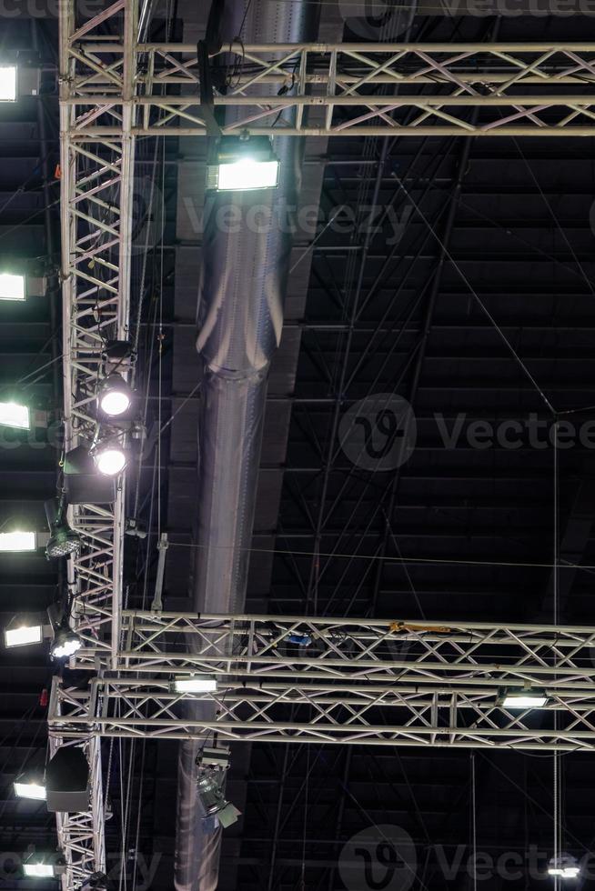 The truss metal frame with the LED system on the ceiling of the modern exhibition. photo