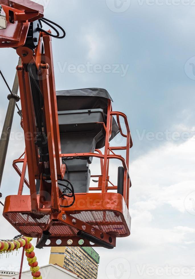 Oragne basket of the hydraulic crane photo