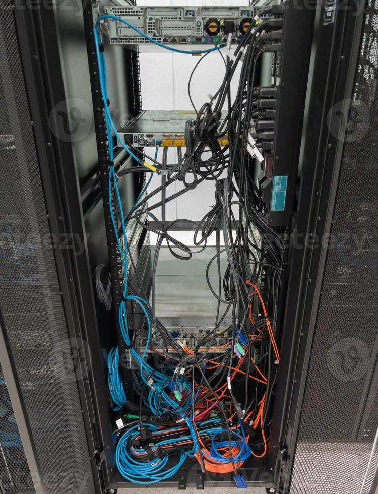 The backside of the server rack after removing the old storage. photo