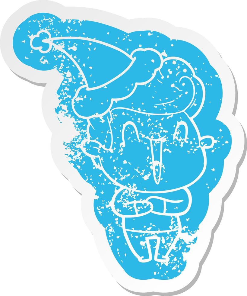 excited man cartoon distressed sticker of a wearing santa hat vector