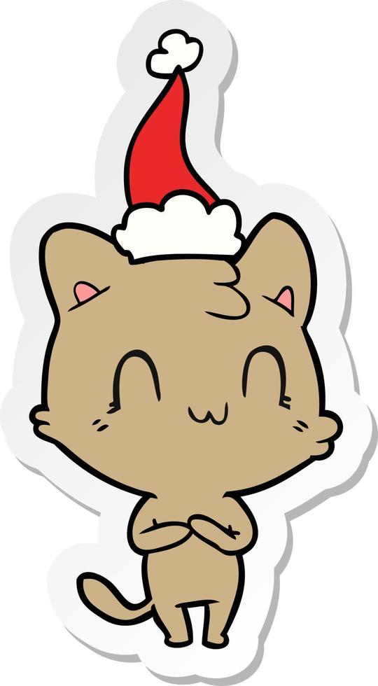 sticker cartoon of a happy cat wearing santa hat vector