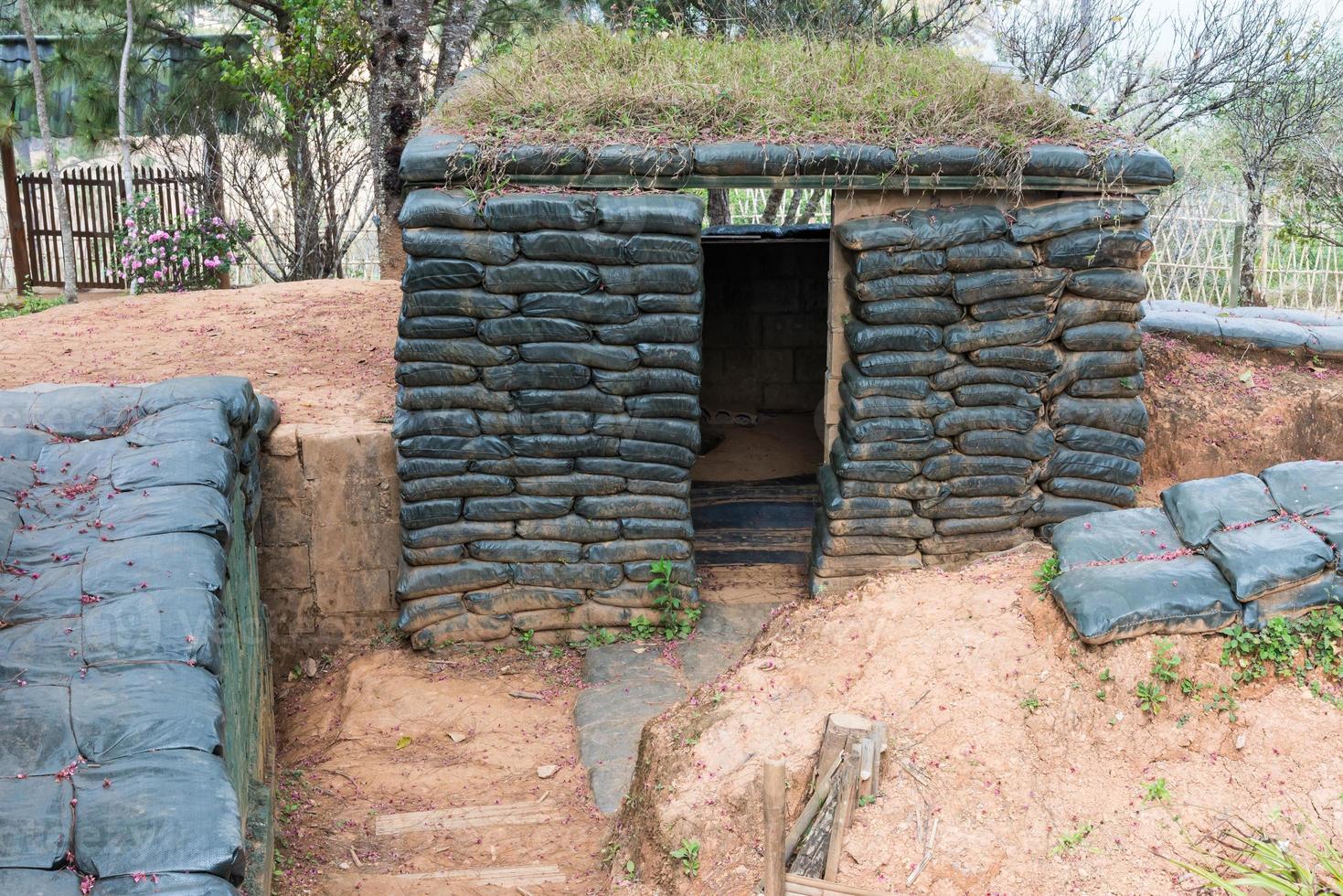 Cement shelter with sandbag photo