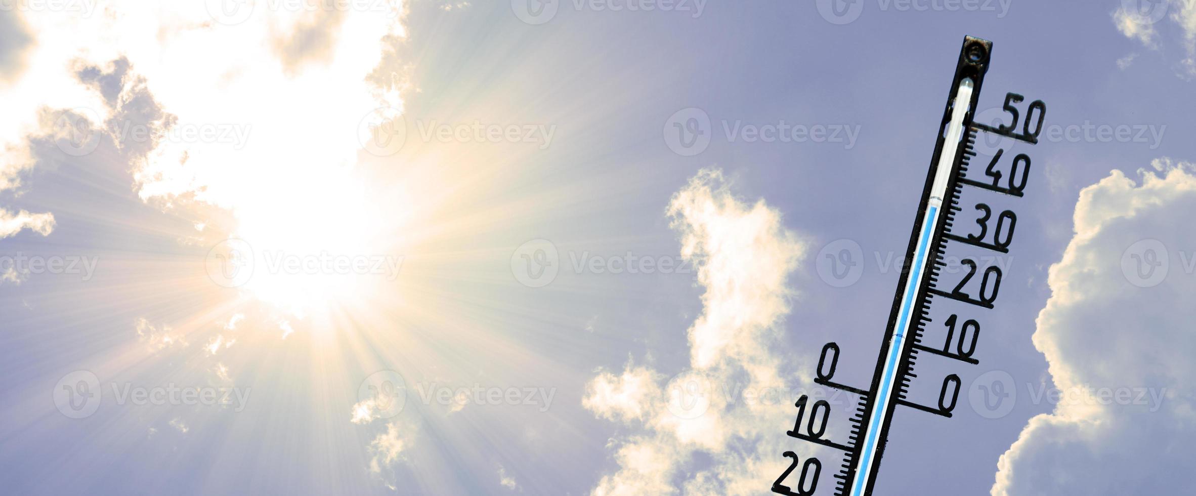 Thermometer with celsius scale showing extreme high temperature. photo