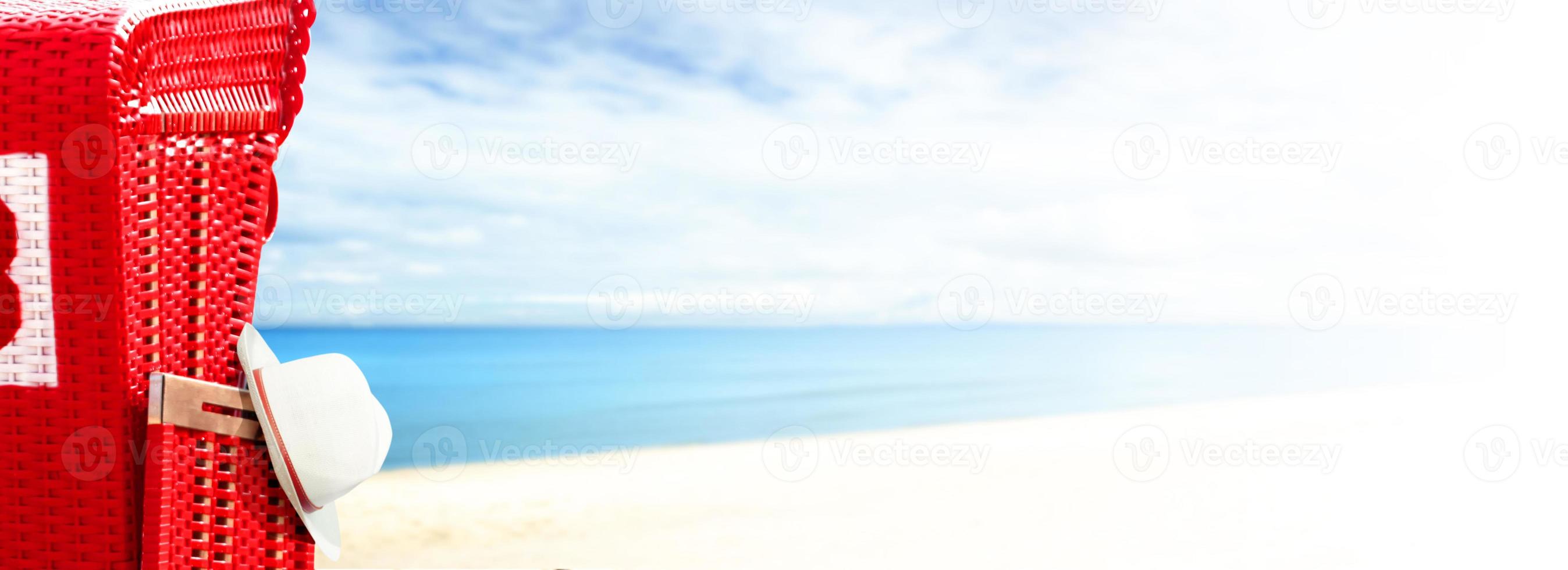 Stormy baltic sea with beach chairs and coastal dunes. photo