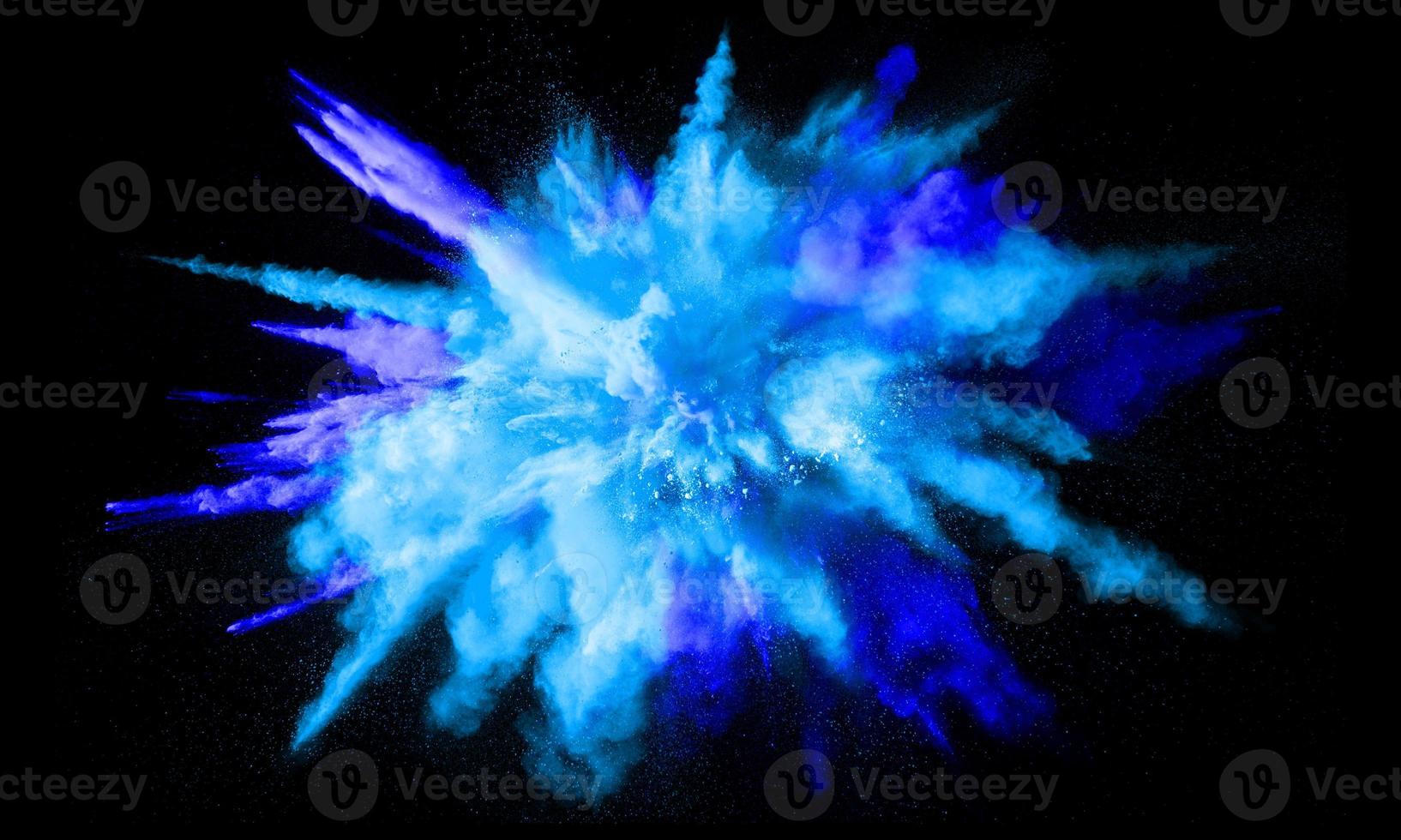 Colorful powder explosion, isolated on black background photo