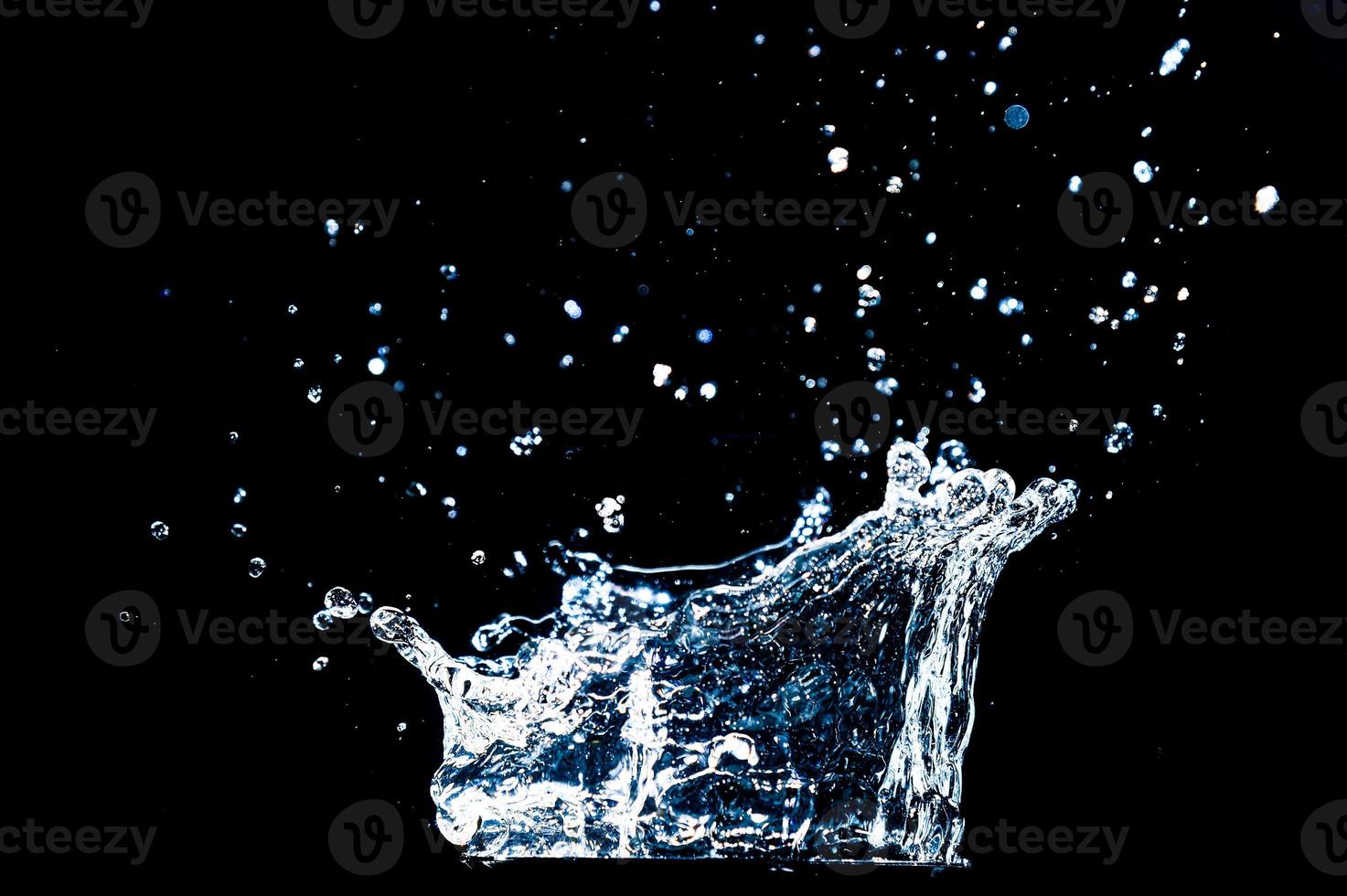 Abstract background of Water splashing on a black background. idea for freshness photo