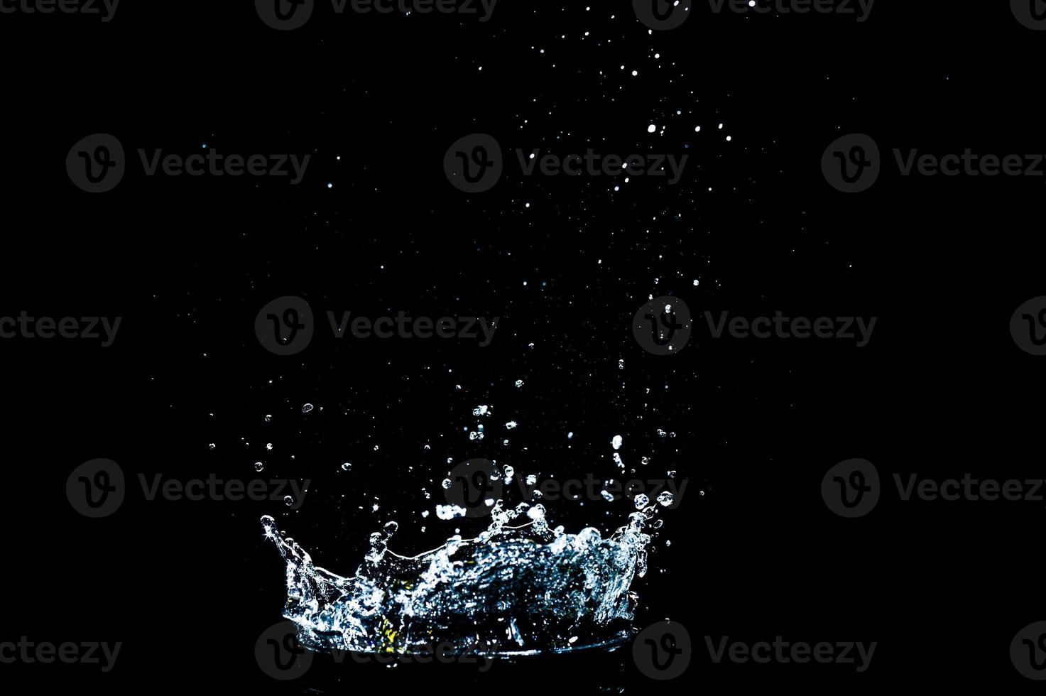 Scattered water splashes on a black background. water splash isolated on the black background photo