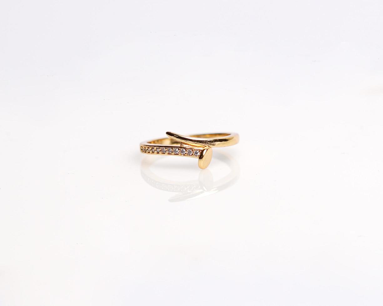 Jewelery ring with diamonds. Wedding rings that have deep meaning and significance. Engagement ring with gemstones. Wedding ring isolated on white background, focus blur. Pair in gold, silver, black. photo