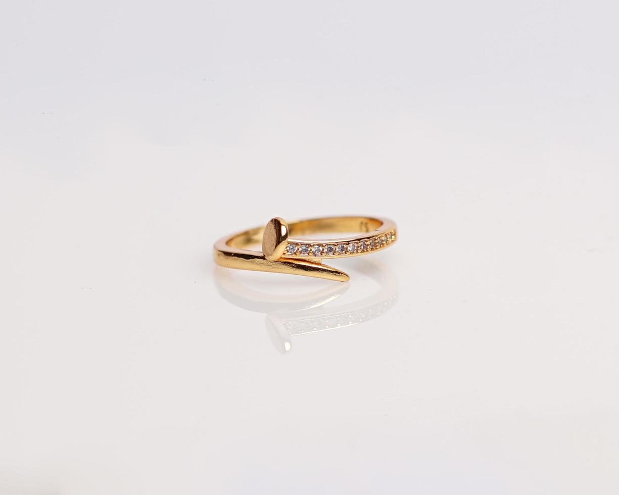 Jewelery ring with diamonds. Wedding rings that have deep meaning and significance. Engagement ring with gemstones. Wedding ring isolated on white background, focus blur. Pair in gold, silver, black. photo