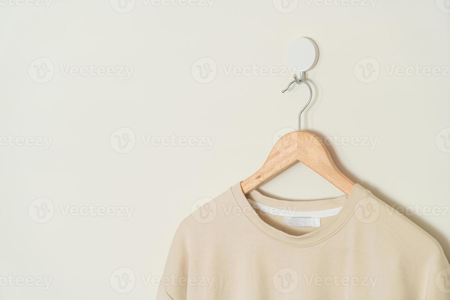 t-shirt hanging with wood hanger photo