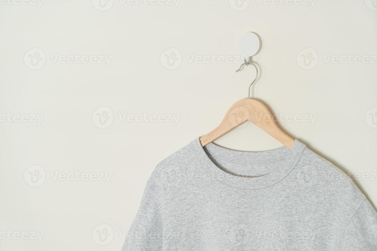 t-shirt hanging with wood hanger photo