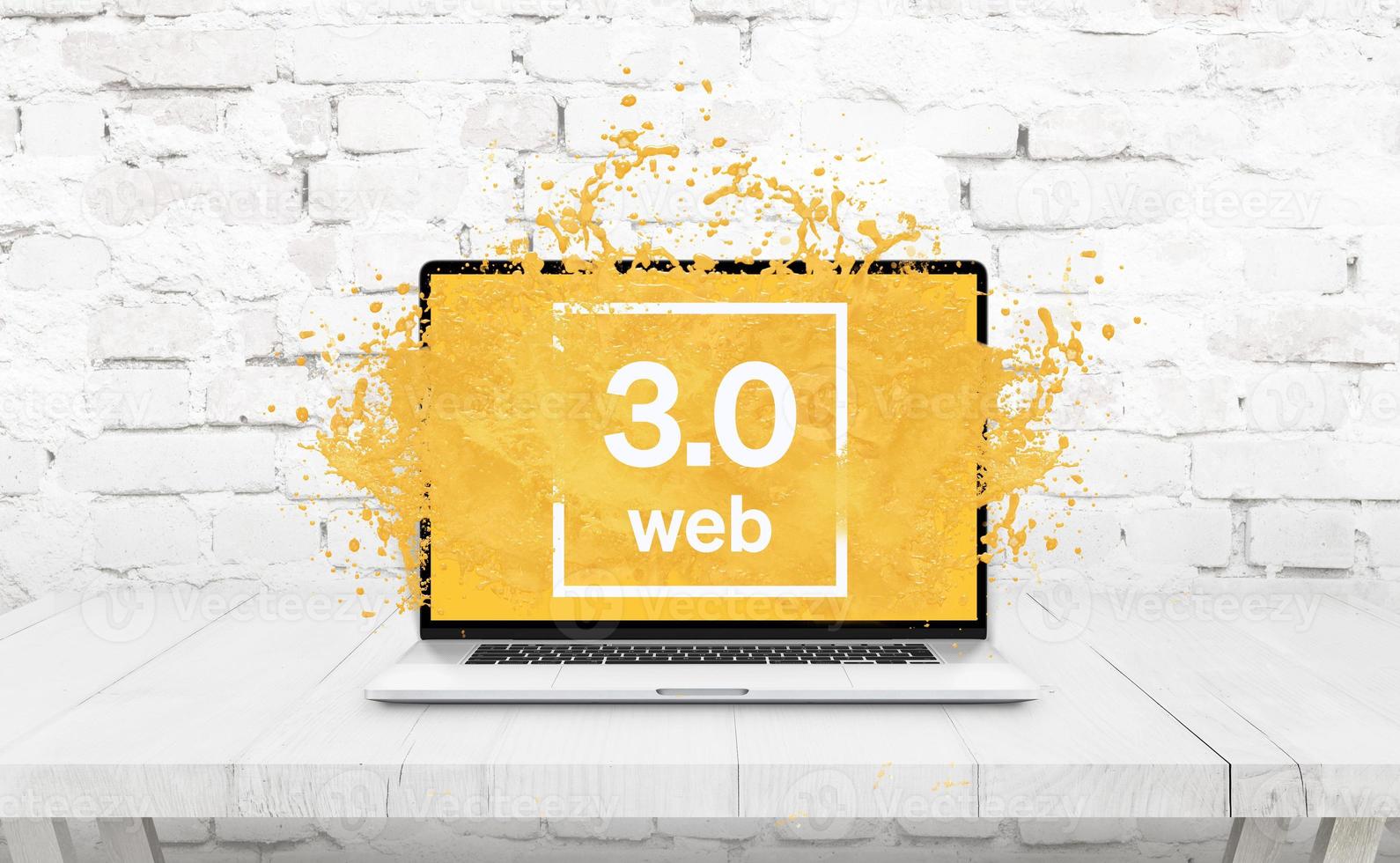 Laptop on the table from which the yellow liquid comes out as a Web 3.0 concept photo