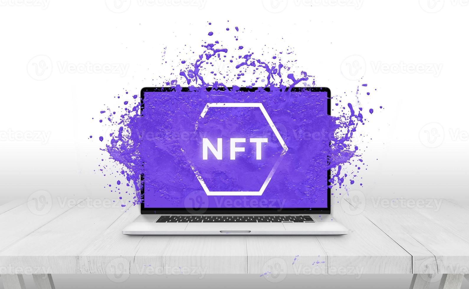 NFT non-fungible token text comes out with purple liquid from laptop display concept photo