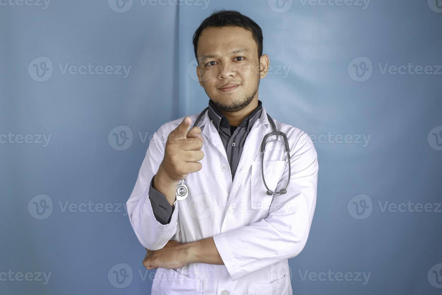 A portrait of an enthusiastic success Asian male doctor. photo