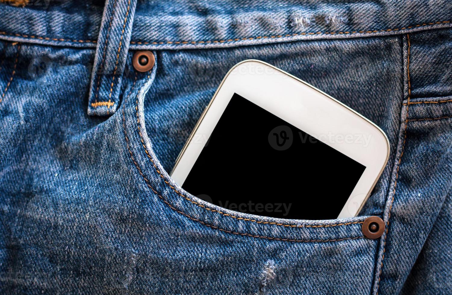 mobile phone in jeans pocket with black screen photo