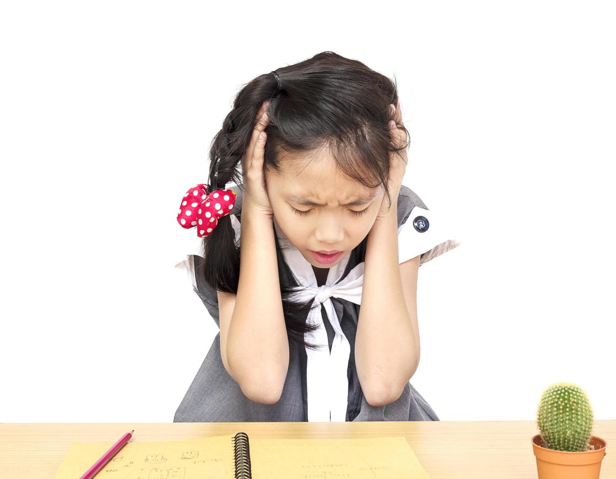 Angry girl is shouting while doing his assignment photo