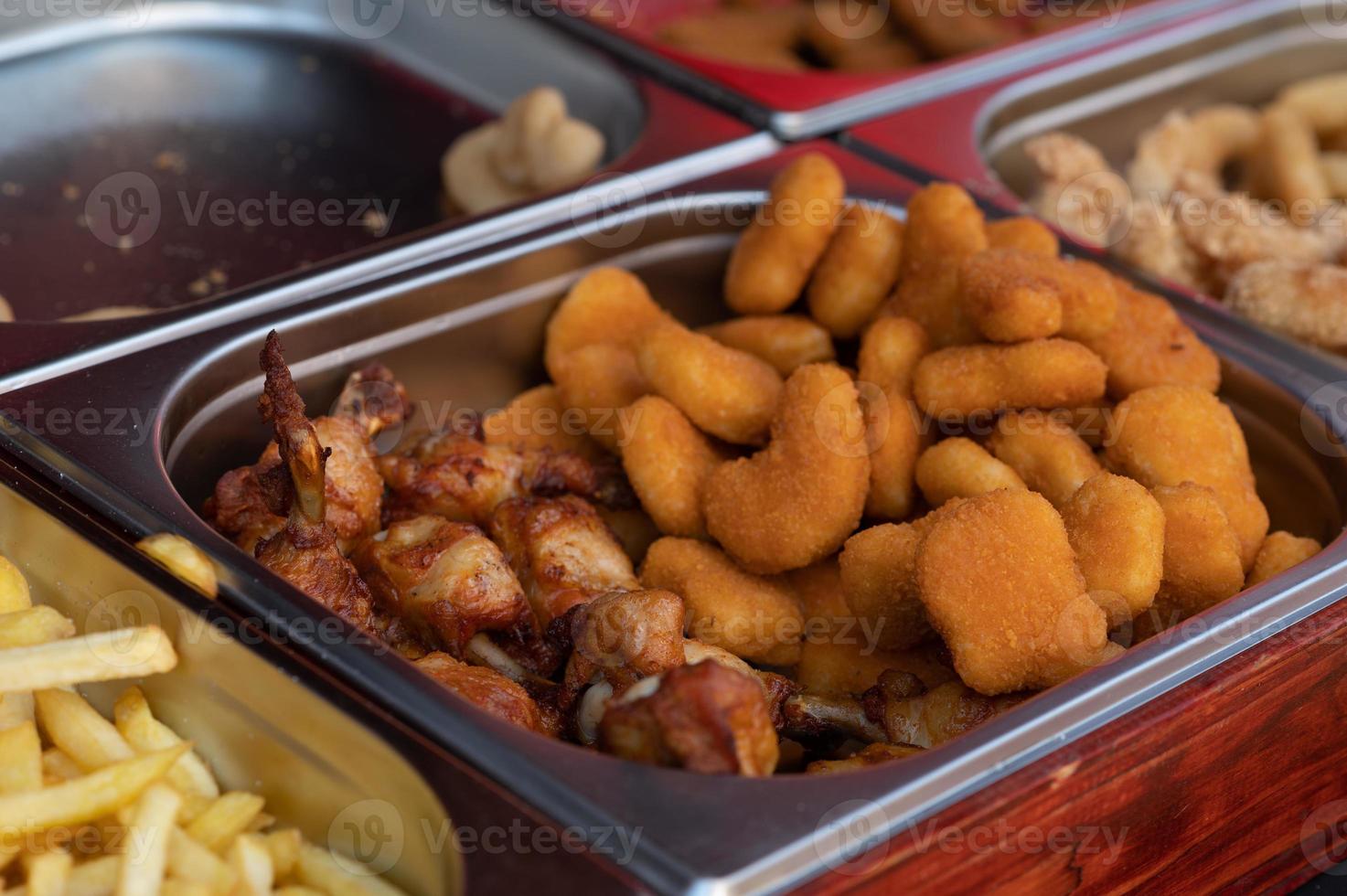 Fried fish or chicken in batter, at the food market - close-up photo