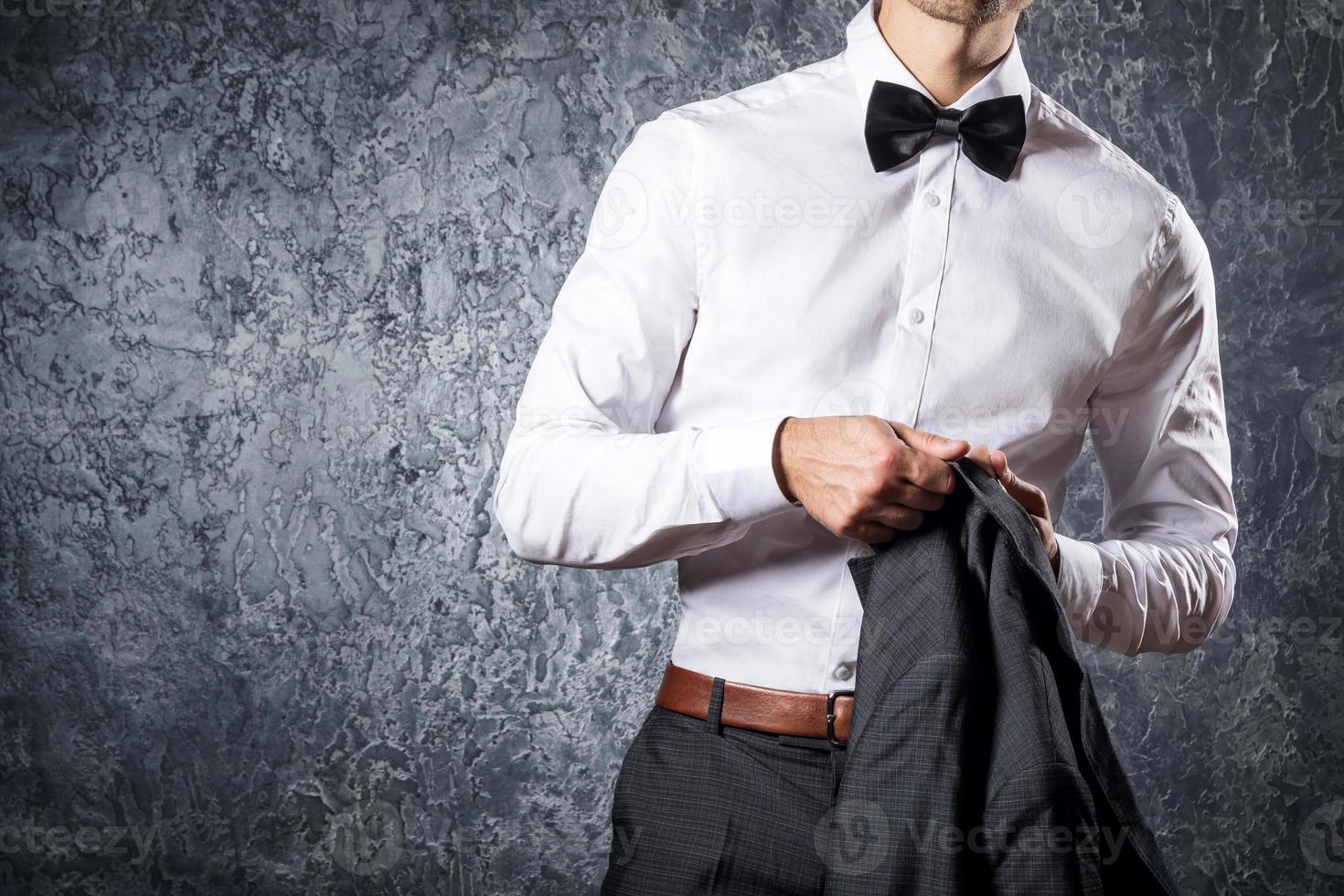 Stylish man in suit with bow tie photo