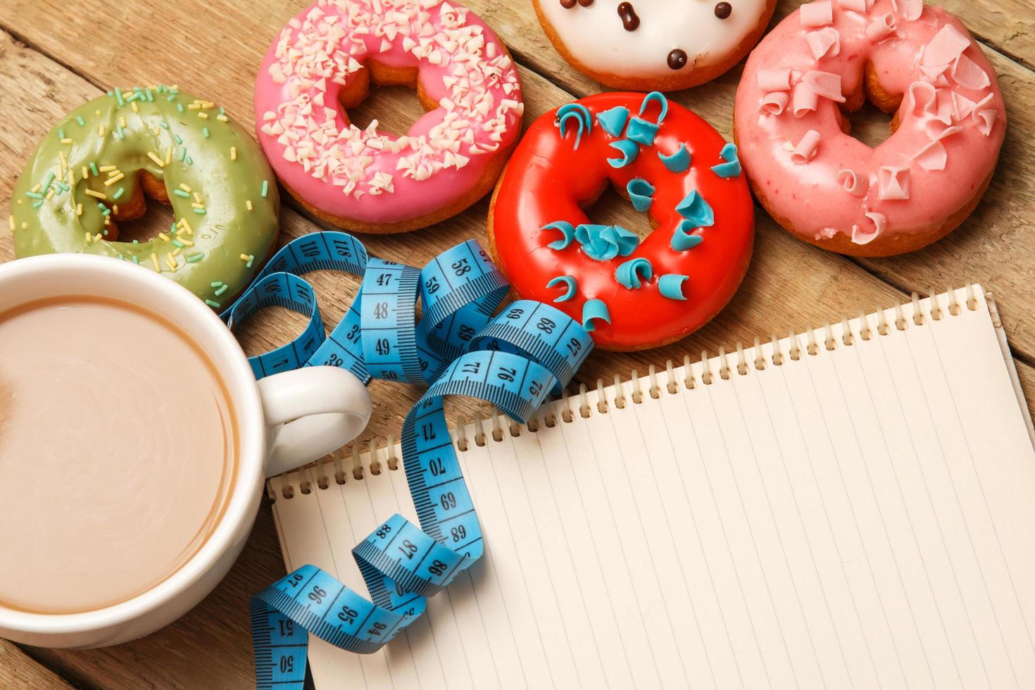 Colorful donuts and notepad photo