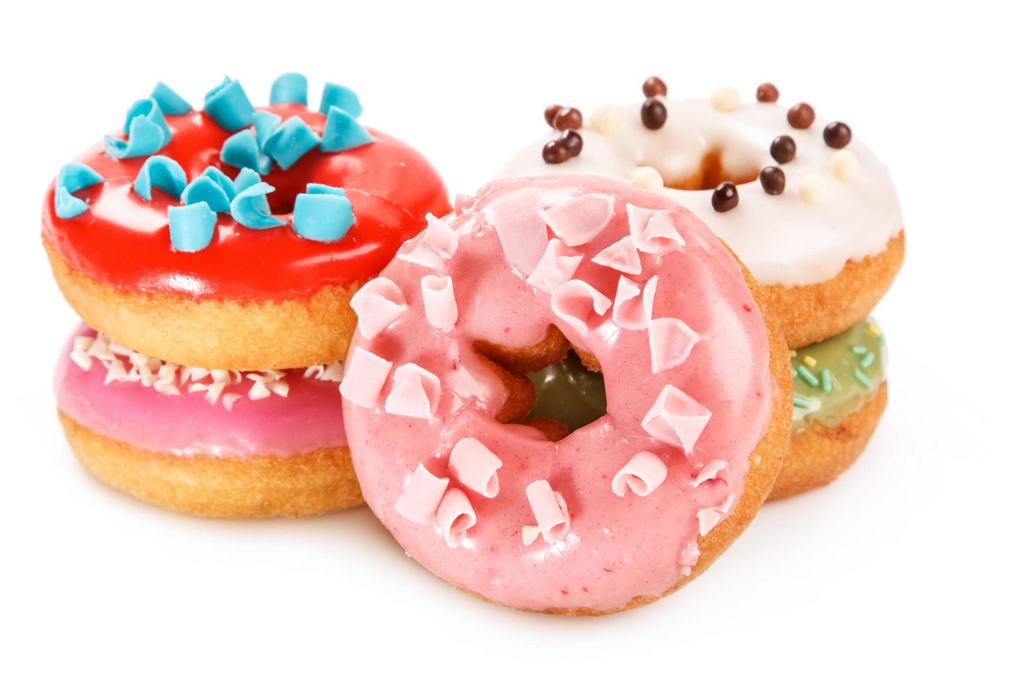 Colorful donuts on white background photo