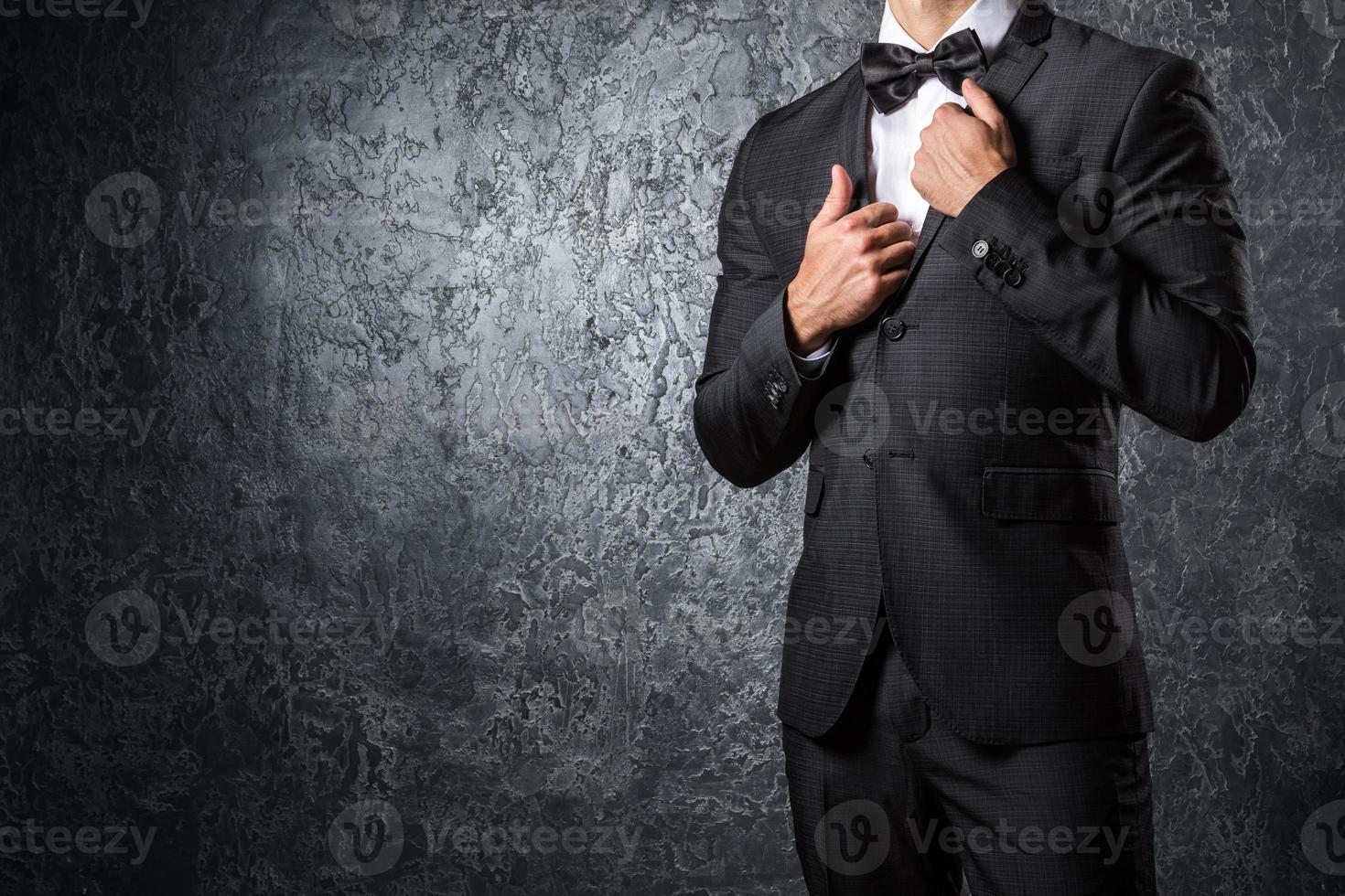 Stylish man in suit with bow tie 8862125 Stock Photo at Vecteezy