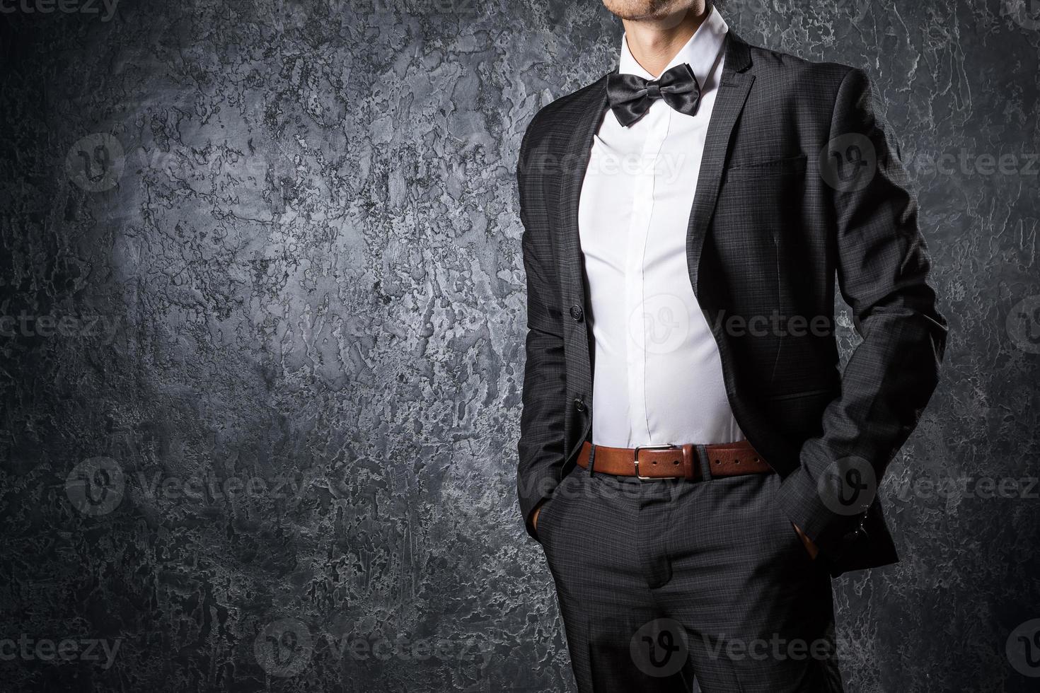 Stylish man in suit with bow tie photo