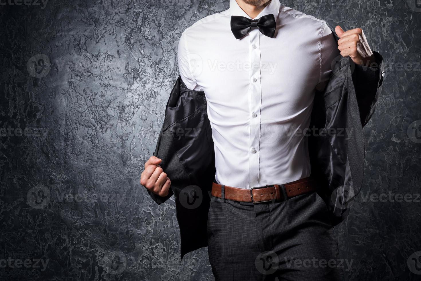 Stylish man in suit with bow tie photo