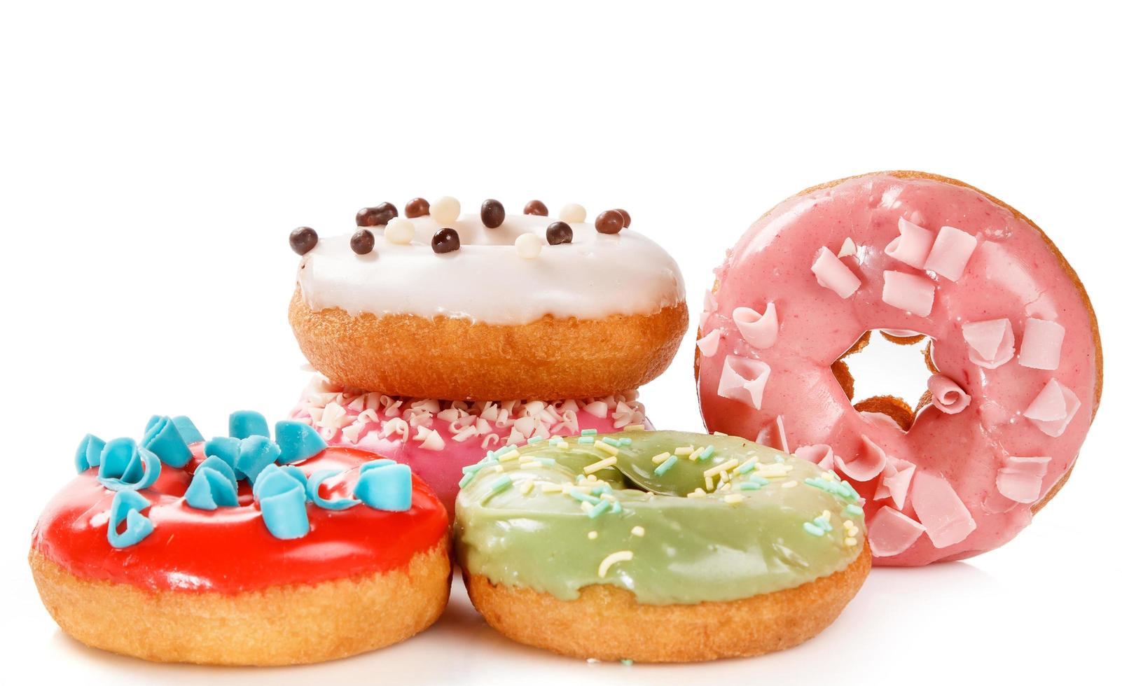 Colorful donuts on white background photo