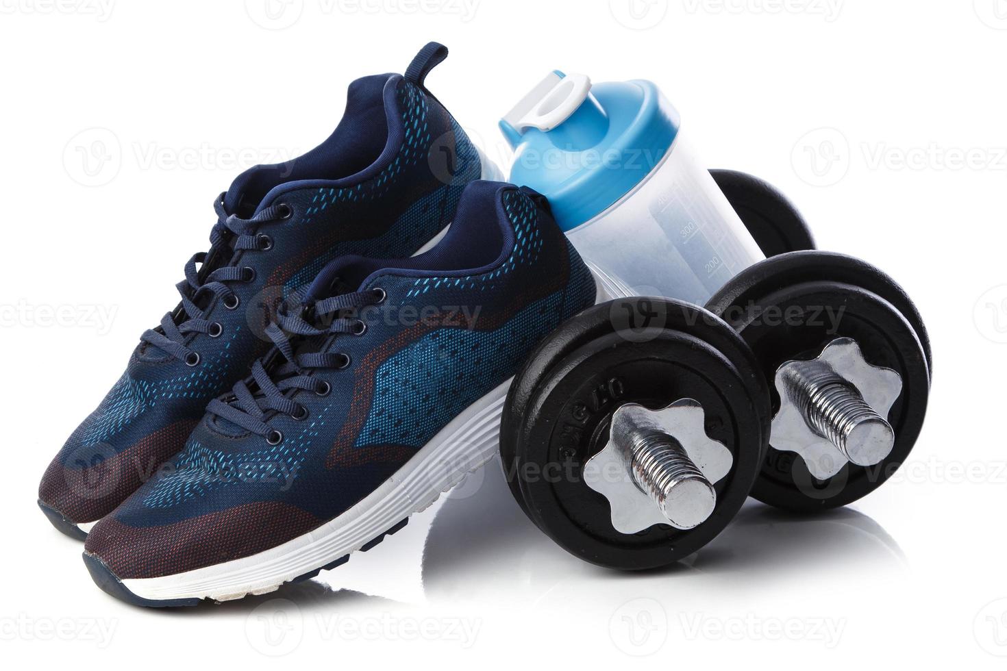 Dumbells, sneakers and shaker photo