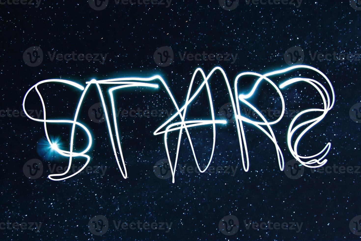 Word STARS on the night sky photo